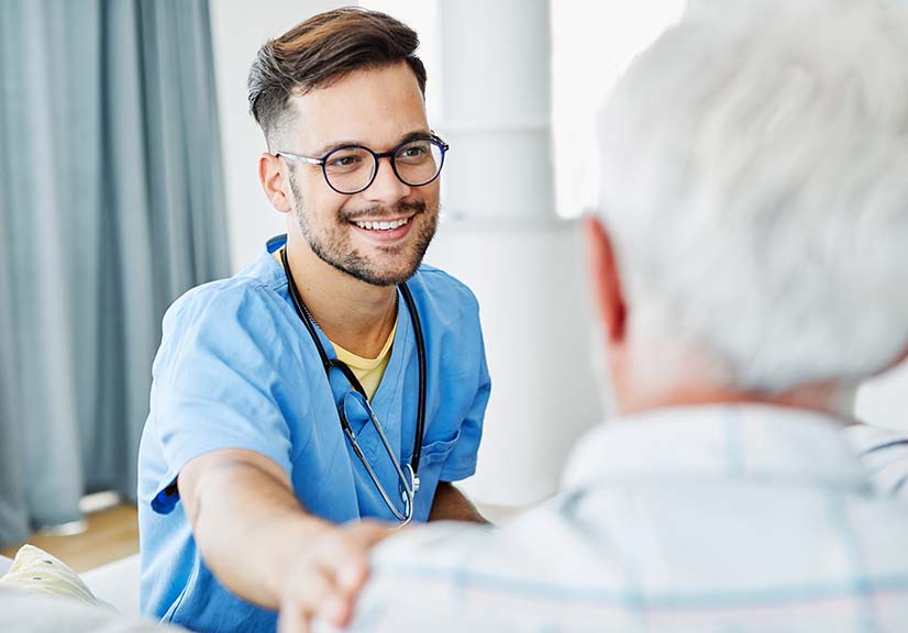 male doctor consulting an older male